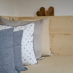 A couch with many throw pillows